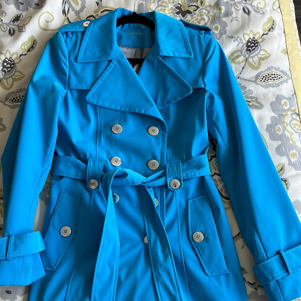 Bright blue Calvin Klein trench coat